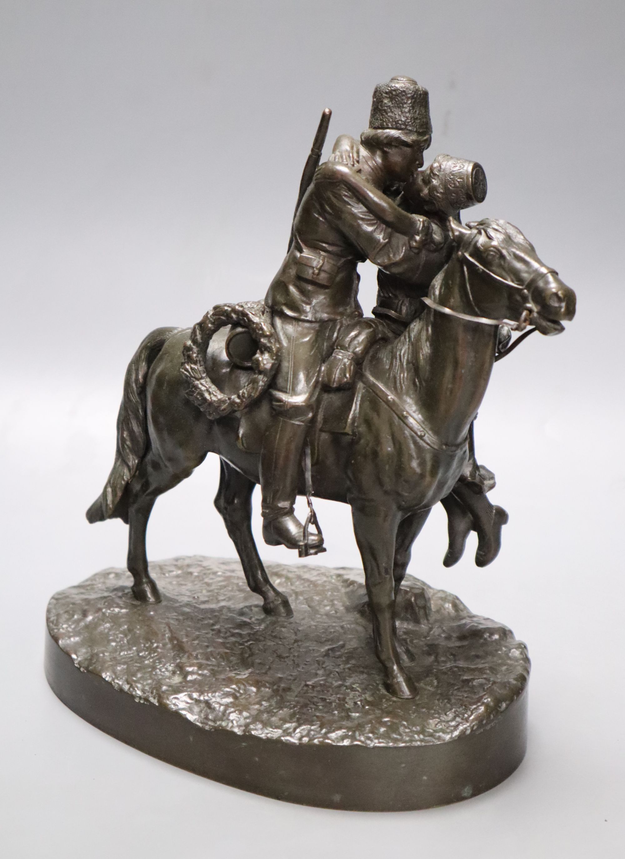 A Russian bronze of a gentleman on horseback kissing his lover, signed, height 25cm